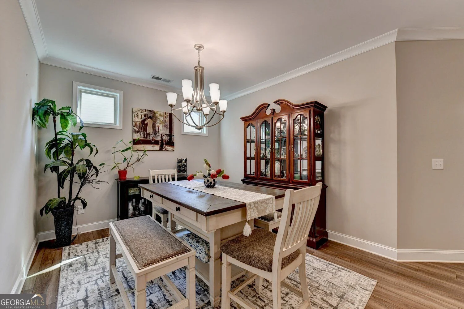Dining room with chandelier and windows