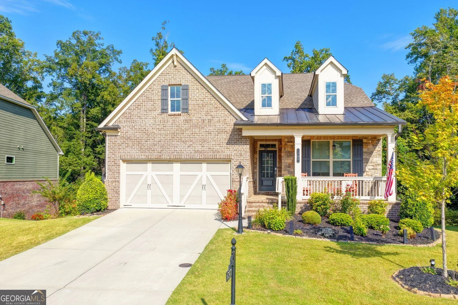 2980 Coach River Way, with brick facade, covered porch and landscaped front yard
