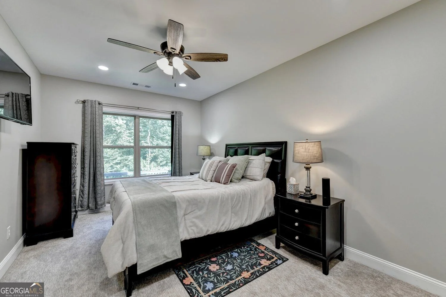 Additional bedroom with windows and neutral finishes